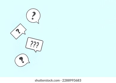 Speech bubbles with question marks on blue background