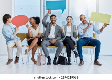 Speech bubbles, voice and vote by business people happy and sitting in an office. A diverse team of employees holding empty comment signs or icons for social media company communication