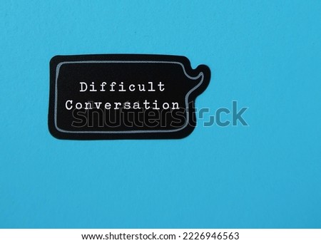 Speech sticker on blue copy space background with text DIFFICULT CONVERSATION concept of request to have serious talk in sensible subjects at work or relationship, discuss personal issues conflict
