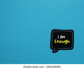 Speech Sticker On Copy Space Blue Background With Handwritten Text I Am Enough - Positive Self Talk Affirmation Mantra To Boost Self Belief And Self Esteem