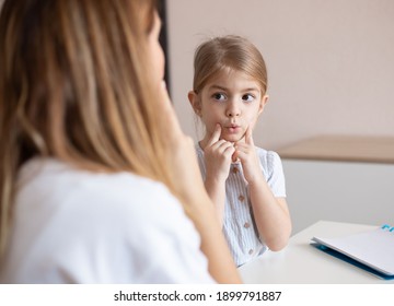 Speech Therapist Practice Therapy For Child With Motor Speech Disorders.