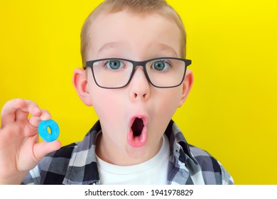 Speech Therapy. Toddler Boy Says The Letter O. Classes With A Speech Therapist. Boy On Isolated Yellow Background