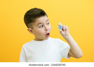 Speech Therapy. Toddler Boy Says The Letter O. Classes With A Speech Therapist. Boy On Isolated Yellow Background