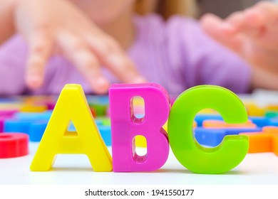 Speech Therapy. Toddler Girl With Letters. Classes With A Speech Therapist. Abc