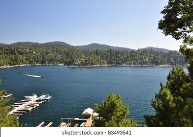 A Speed Boat Cruises Around Beautiful Lake Arrowhead In The San Bernardino Mountains Of California.