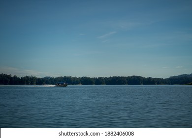 Speed Boat Moving Fast On A Lake.