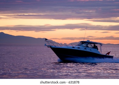 Speed Boat On A Sunset Background