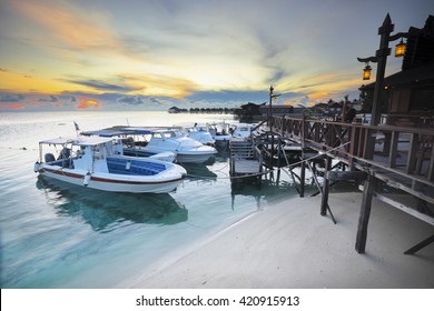 Speed Boat Parking In Jetty With Dramatic Sunset In Mabul Island , Malaysia