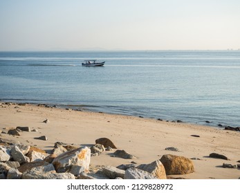 Speed Boat Passing Penang Beach In The Morning