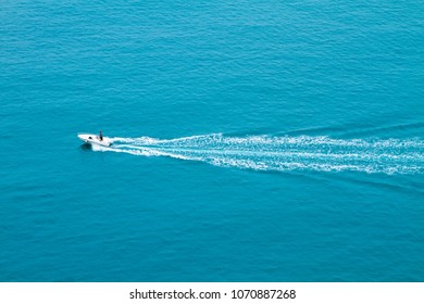 Speed Boat Quickly Floating On The Water Surface And Leaving A Trail On The Sea.