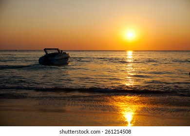 Speed Boat In The Sea At Sunset