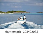 Speed boat with tourists in the Maldvies