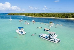 Speed Boats With People Having Fun In Caribbean Sea Near Tropical Island With Palm Trees. Travel Destination. Dominican Republic. Aerial View
