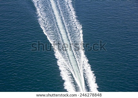Speed boats trace on the blue sea 