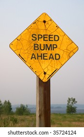 Speed Bump Ahead Sign In Nature