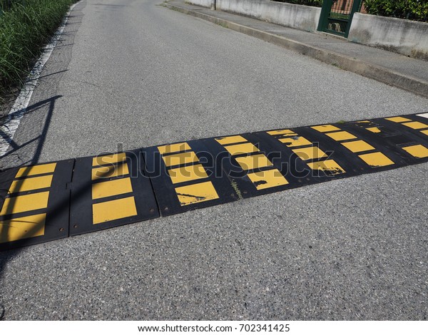 speed bump (aka as speed hump or
sleeping policeman) to limit speed of cars traffic
sign