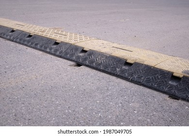 Speed Bump On An Asphalt Road, Speed Breaker, Road Bumps In The Middle Of The Road