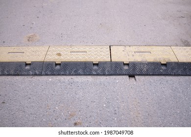 Speed Bump On An Asphalt Road, Speed Breaker, Road Bumps In The Middle Of The Road