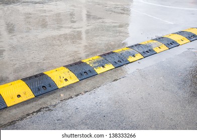 Speed Bump On Wet Road Stock Photo 138333266 | Shutterstock