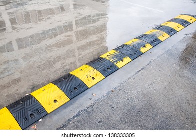 Speed Bump On Wet Road Stock Photo 138333305 