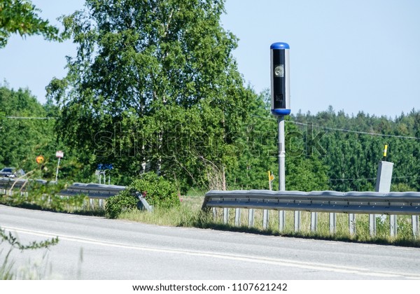 Speed\
camera along a road in the countryside.\
Sweden.