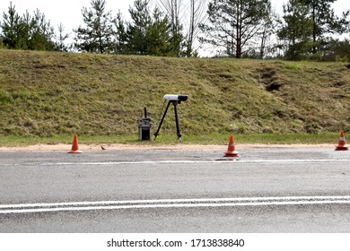 speed camera stands on the side of a freeway