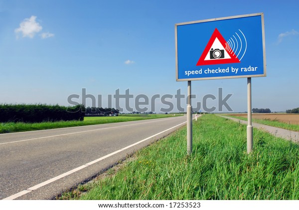 Speed checked by radar roadsign in rural landscape\
on empty road