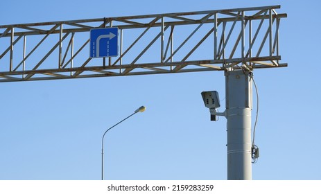 Speed control camera and marking lines above the road.