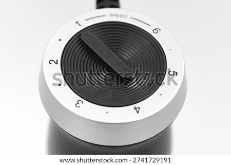 Speed control dial on a device for adjusting settings
