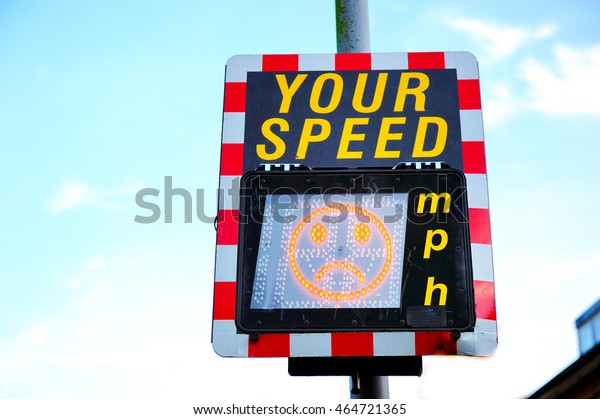 Speed limit\
digital sign, it shows frown\
face
