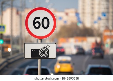 Speed limit roadsign against road traffic