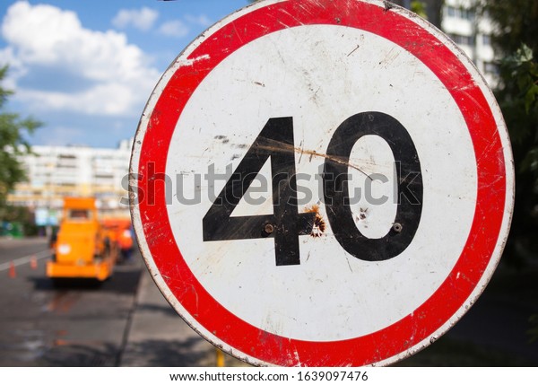 Speed limit sign. 40 kilometers (miles) per\
hour. Close-up.