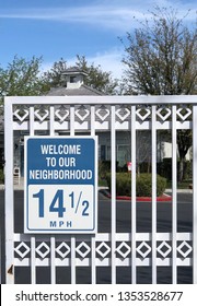 Speed Limit Sign Posted On The Gate Of Gated Community - Speed Limit Is 14 1/2 Miles Per Hour