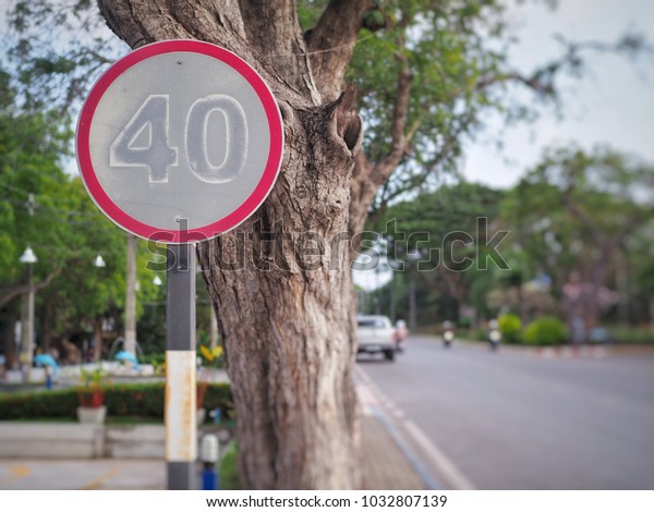 Speed limited 40 km/h warning sign panel on the\
road, Traffic sign for do not drive more than 40 kilometers per 1\
hour on the street