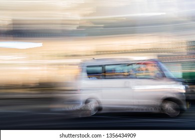 Speed Motion Abstract Blurred Of Taxi With Neon Urban Night Light At Shinjuku Road In Tokyo Japan With Billboard Background