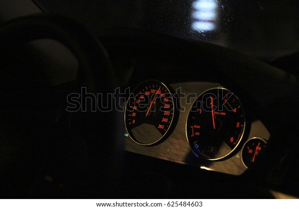 The speed reading on the\
speedometer of the machine in motion. Red color of the\
instruments.