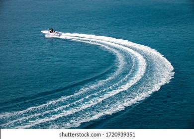 Speedboat Runs Fast In The Open Sea And Leaves The Engine's Wake In The Water