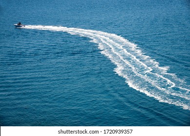 Speedboat Runs Fast In The Open Sea And Leaves The Engine's Wake In The Water