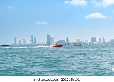 Speedboat sailing on the blue tropical sea on the background of Pattaya cityscape view and clear sky morning day at Koh Larn island. Speed boat running on the bay, Panorama ocean, Thailand, Vacation. - Powered by Shutterstock