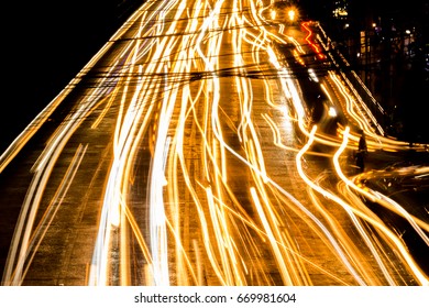 Speeding Car In Night Life Road, Slow Speed Shutter Light.