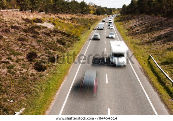 Speeding cars on a UK\
road
