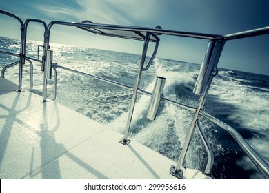 Speeding Motor Boat On The Ocean Before Sunset. Vacation, Summer, Travel. Boating, Rental, Sales And Life Style Concept. 