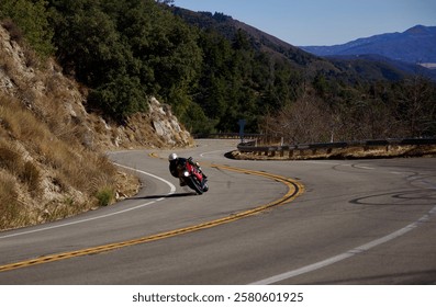 Speeding motorcycles on a winding mountain road 