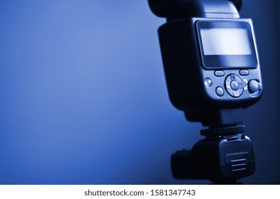 Speedlight gun with trigger set mounted on tripod. phantom classic blue color tone