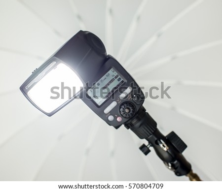 Speedlight with umbrella