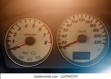 The speedometer of the car. All arrows are at zero.