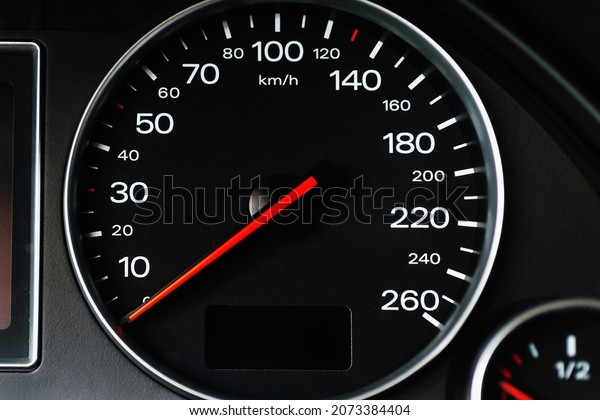 Speedometer in a car. Car dashboard. Dashboard
details with indication lamps.Car instrument panel. Dashboard with
speedometer.Car detailing. Modern interior.Closeup.Copy
space.