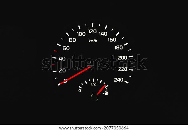 Speedometer in a car. Car\
dashboard. Dashboard details with indication lamps.Car instrument\
panel. Dashboard with speedometer shows 0 km. Modern interior of\
car.