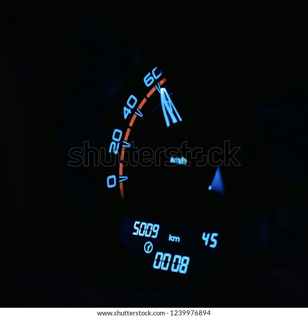 Speedometer in\
the car on the dashboard. Car\
dashboard