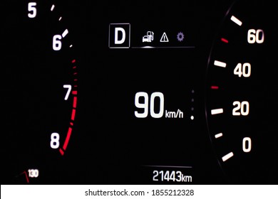 Speedometer In The Car On The Dashboard. The Car's Speedometer Shows 90 Mph